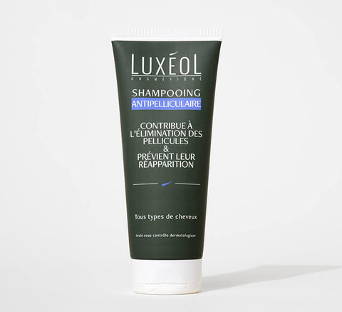 Luxéol šampūns pret matu blaugznām uz balta fona